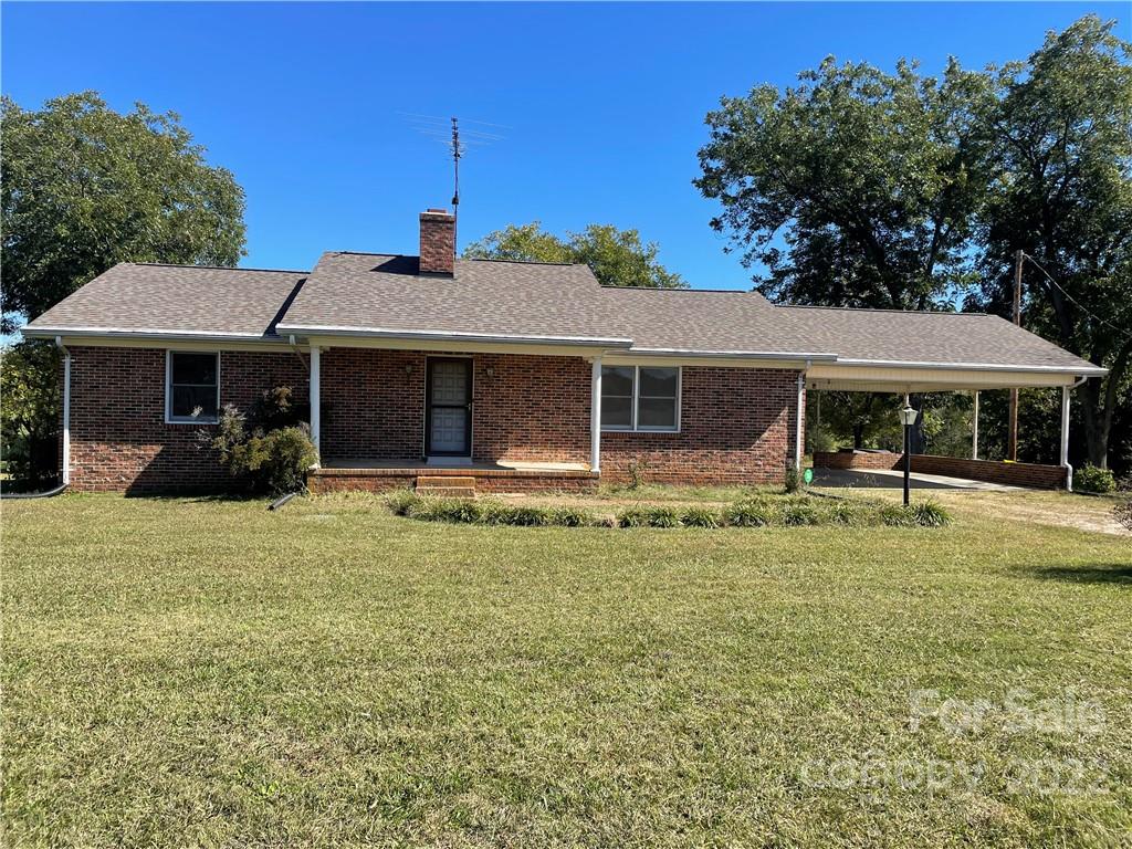 2575 Briggs Road Salisbury, NC 28147 - Photo 1 of 13 a front view of a house with a garden