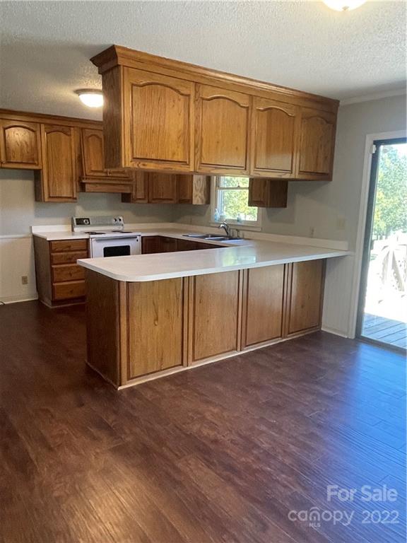 2575 Briggs Road Salisbury, NC 28147 - Photo 4 of 13 a kitchen with stainless steel appliances granite countertop a stove a sink and a microwave
