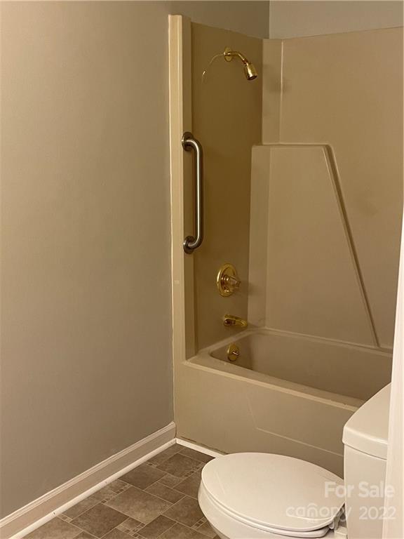 2575 Briggs Road Salisbury, NC 28147 - Photo 10 of 13 a white toilet and tub next to a bathroom