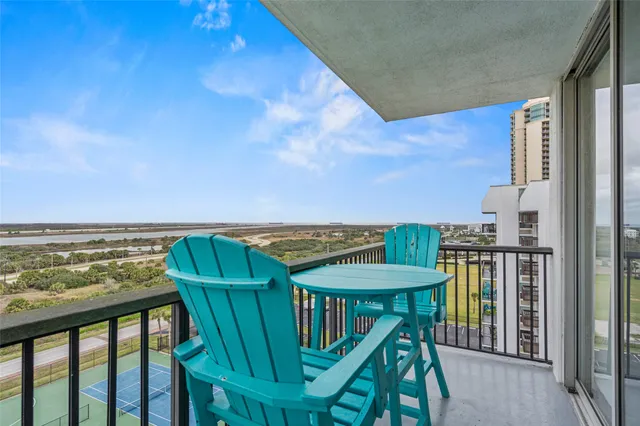 a view of a balcony with an ocean view