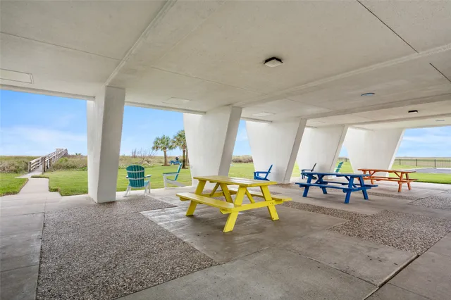 a view of swimming pool with outdoor seating and plants