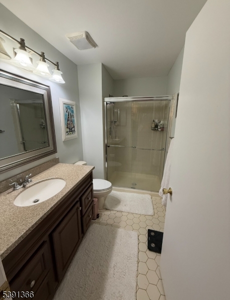 122 Irving Place Bernards, NJ 07920 - Photo 15 of 20 a bathroom with a granite countertop sink a toilet a mirror and shower