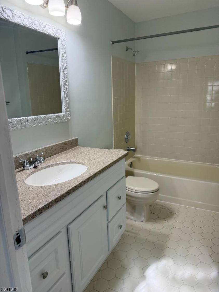 122 Irving Place Bernards, NJ 07920 - Photo 18 of 20 a bathroom with a granite countertop sink toilet and shower