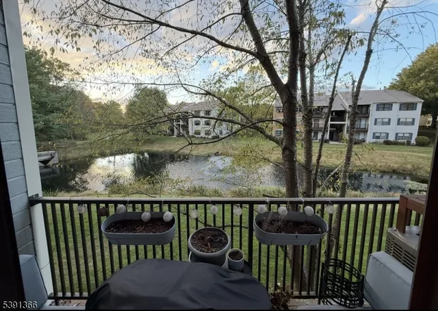 a view of a lake with a house in the background