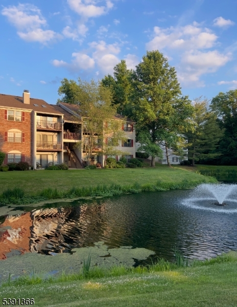 122 Irving Place Bernards, NJ 07920 - Photo 20 of 20 a view of a lake with a house in the background