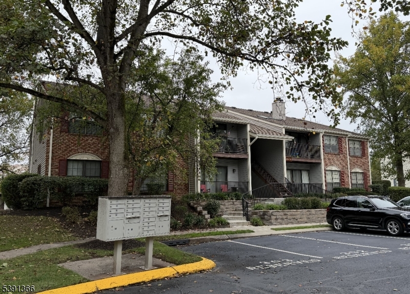 122 Irving Place Bernards, NJ 07920 - Photo 2 of 20 a view of a car parked in front of a white house