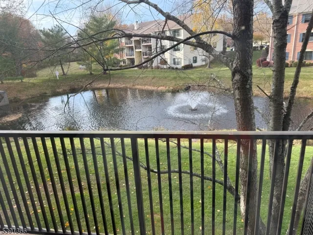 a view of a balcony with yard