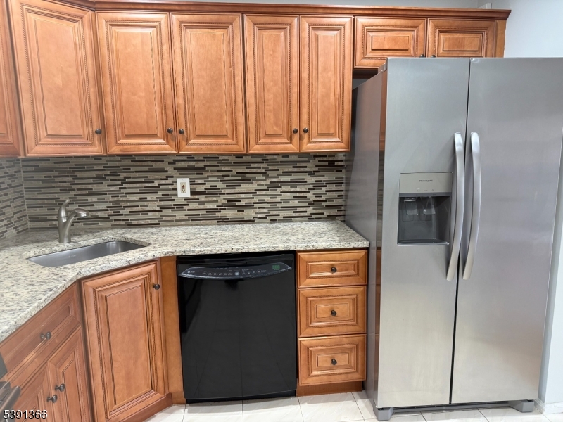 122 Irving Place Bernards, NJ 07920 - Photo 10 of 20 a kitchen with stainless steel appliances granite countertop a refrigerator and a sink