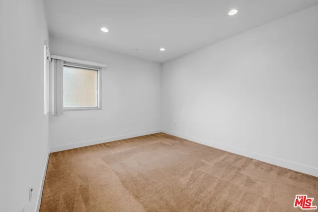 an empty room with a empty space and window