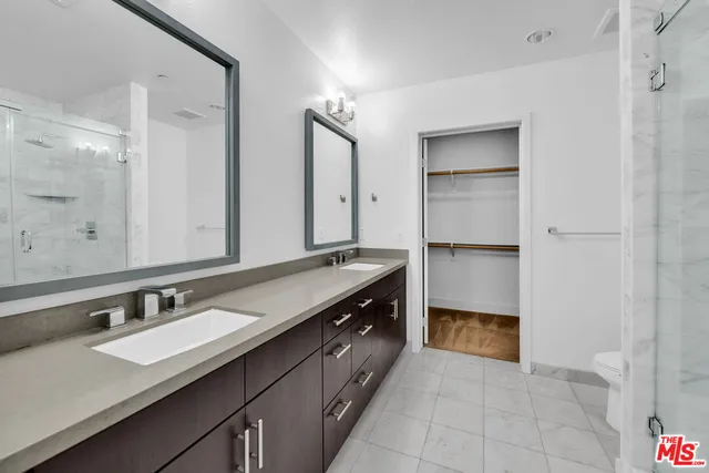 a bathroom with a shower and toilet