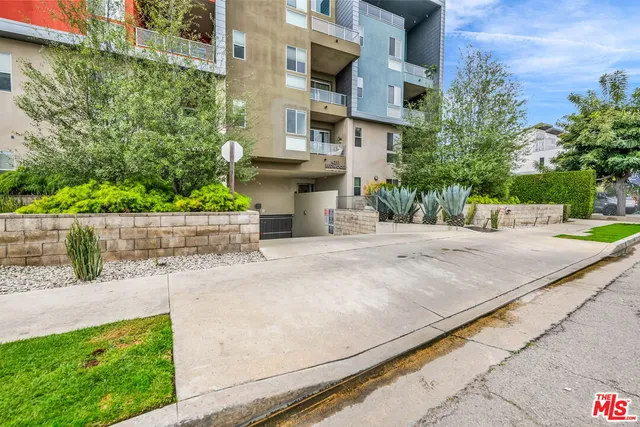 a view of street with tall buildings