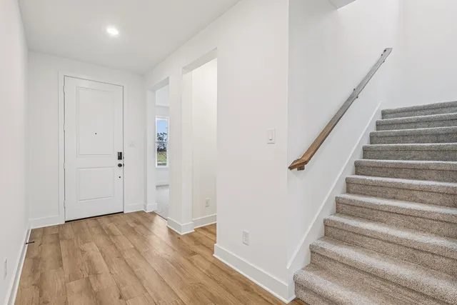 a view of entryway with wooden floor