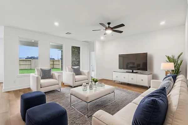 a living room with furniture and a flat screen tv