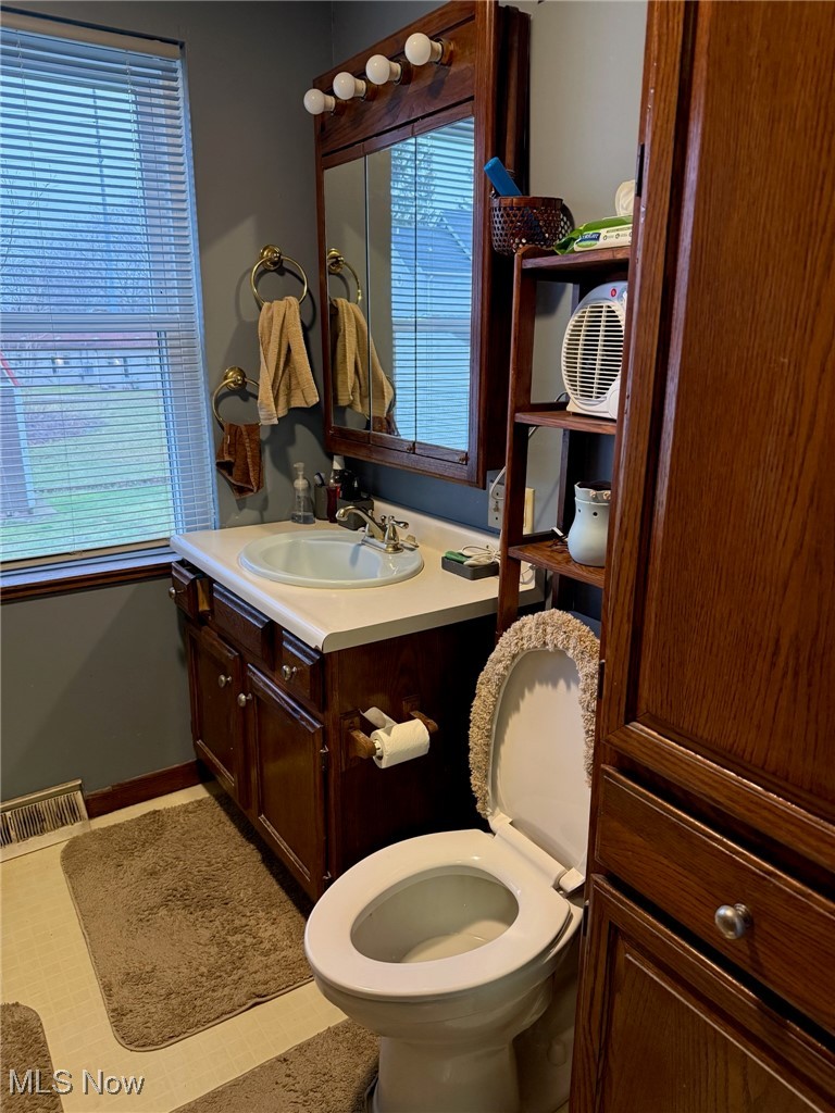 1311 Warner Road Southeast Canton, OH 44707 - Photo 8 of 14 Bathroom with vanity and toilet