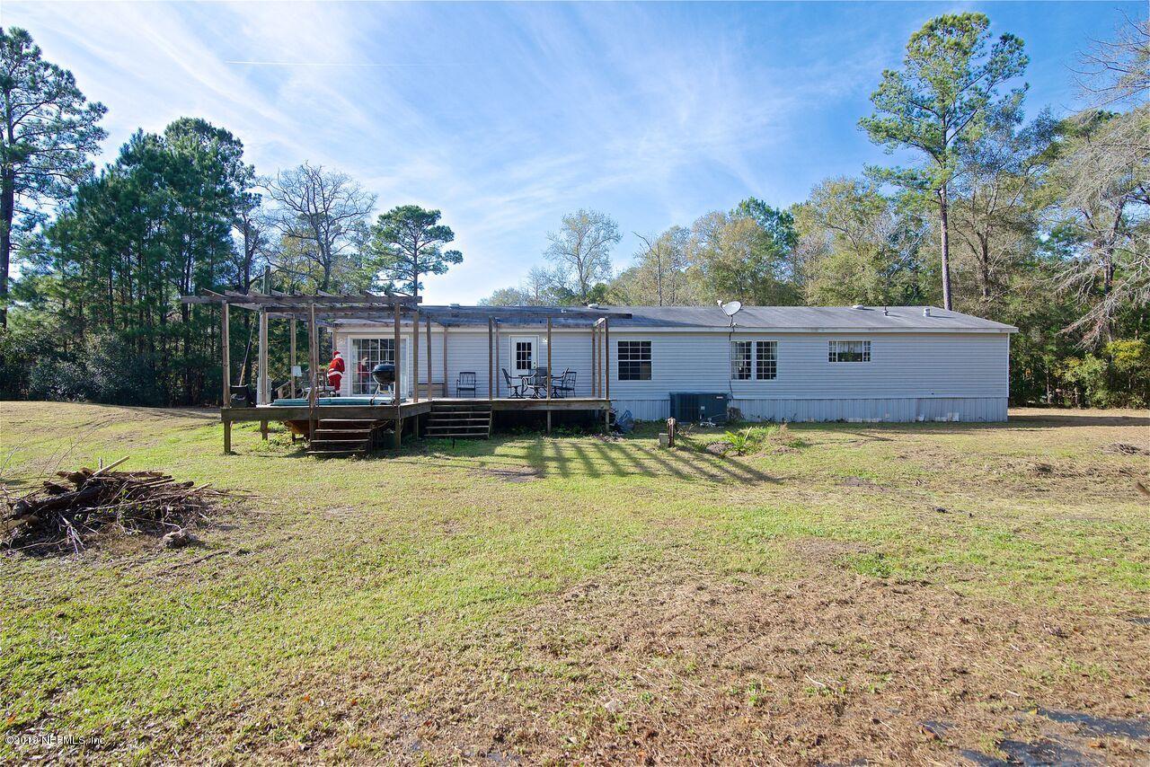45214 Arline Road Callahan, FL 32011 - Photo 18 of 18 a view of a house with a swimming pool