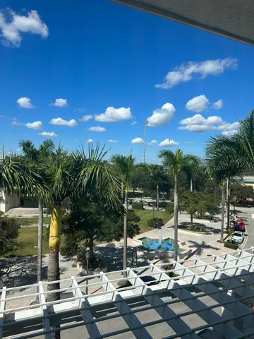 a view of swimming pool with a patio and yard