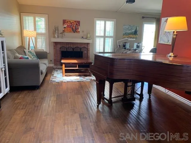 2710 Glasgow Drive Carlsbad, CA 92010 - Photo 3 of 10 a living room with furniture and a fireplace