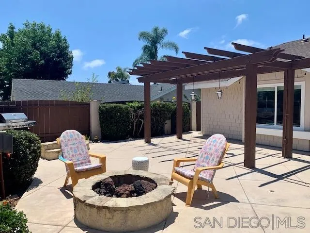 2710 Glasgow Drive Carlsbad, CA 92010 - Photo 5 of 10 a view of a patio with a table and chairs and potted plants
