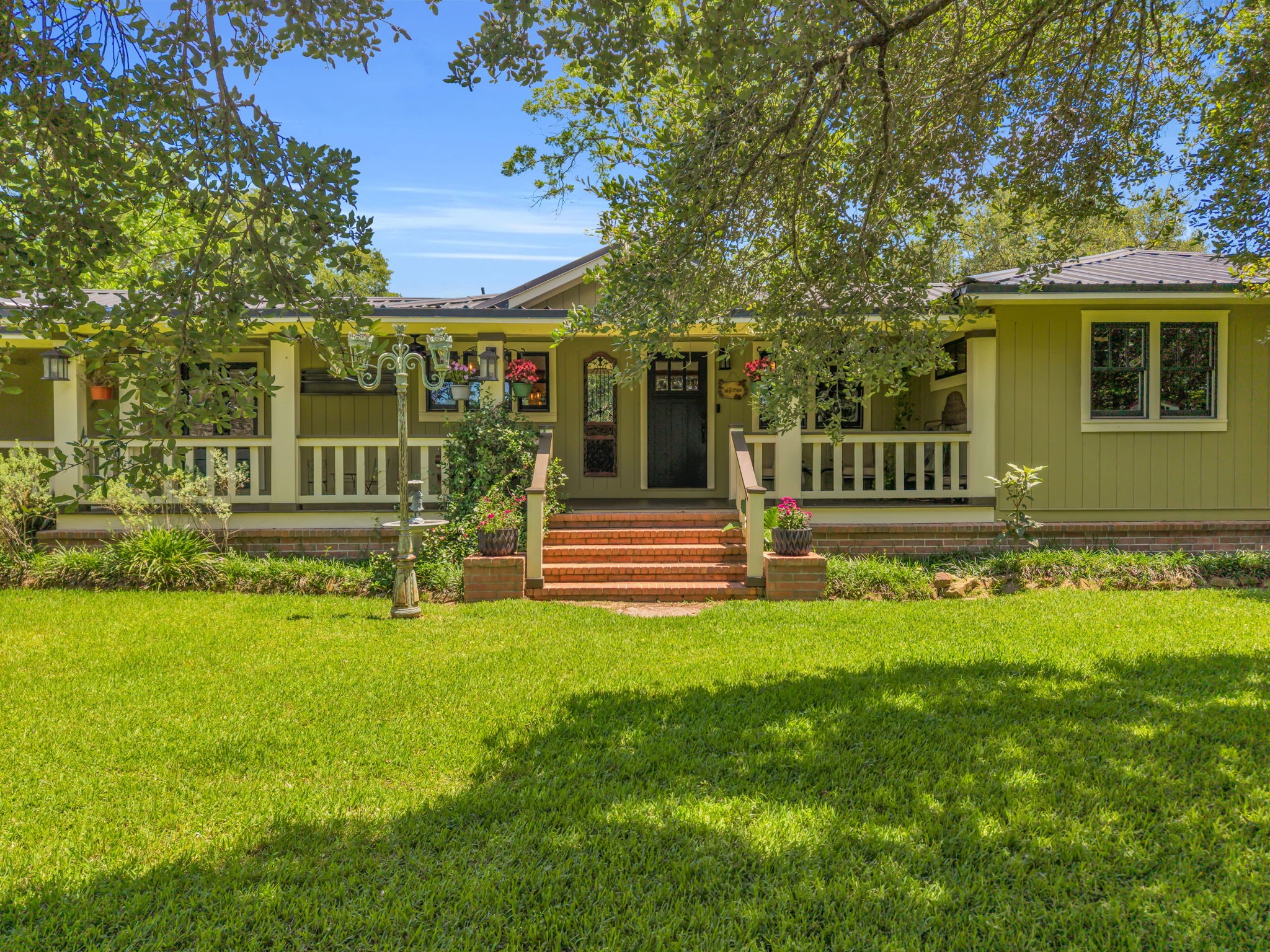 17821 Brown Road Conroe, TX 77306 - Photo 4 of 50 a view of a house with backyard and a tree