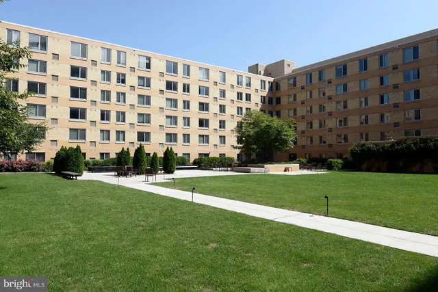 a view of a building with a yard