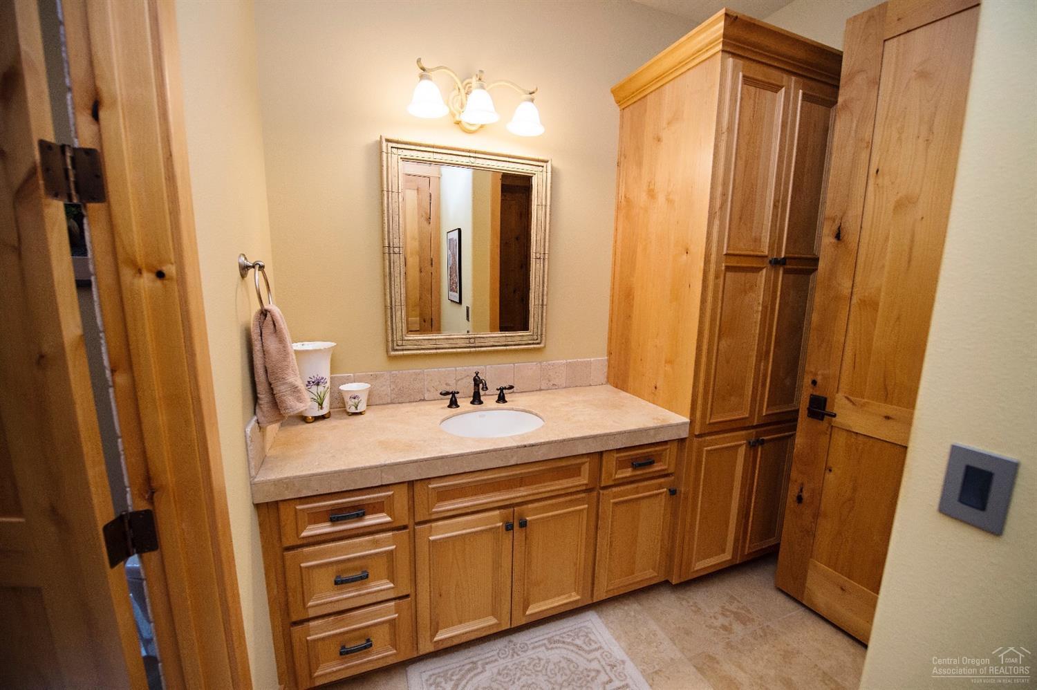 61831 Fall Creek Loop Bend, OR 97702 - Photo 10 of 23 Down Stairs Guest Bath access by hall an