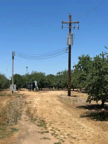 a view of a street with a building in the background