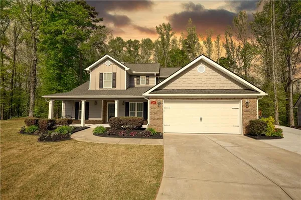 a front view of a house with garden