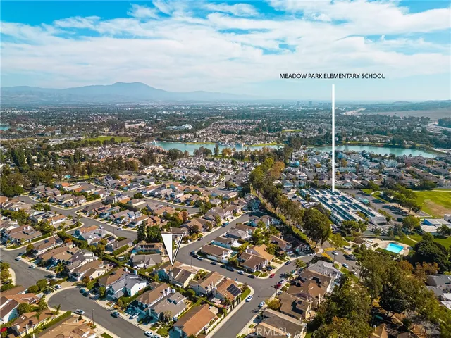 a view of a hallway with windows and entryway