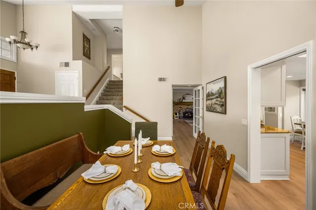 a living room with a fireplace and a potted plant