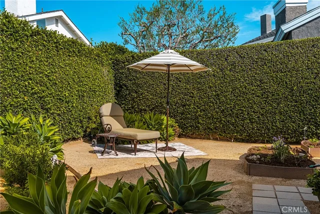 a bathroom with a granite countertop sink a toilet and a shower