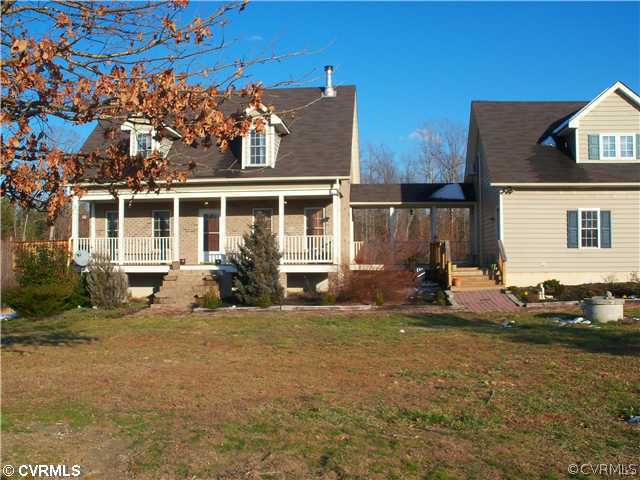28057 Lewis Moore Road Ruther Glen, VA 22546 - Photo 1 of 12 Exterior Front - Splotches of snow remain.