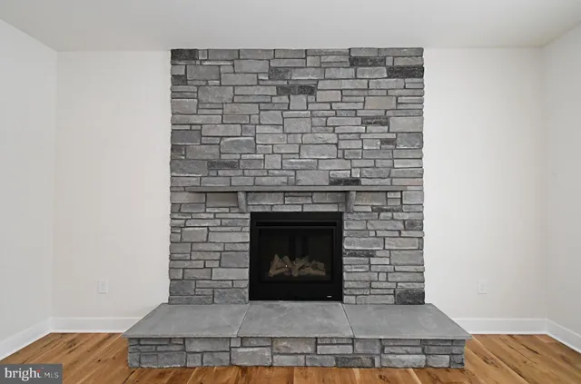a living room with a fireplace