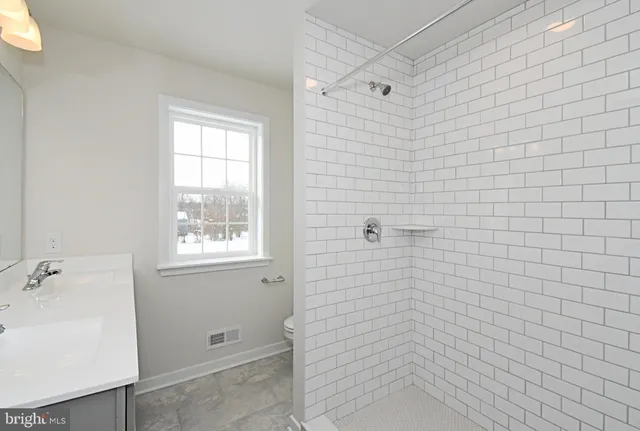 a view of empty room with windows