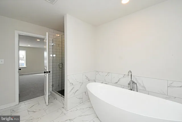 a bathroom with a sink double vanity and a mirror