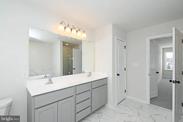 a bathroom with a shower and a sink