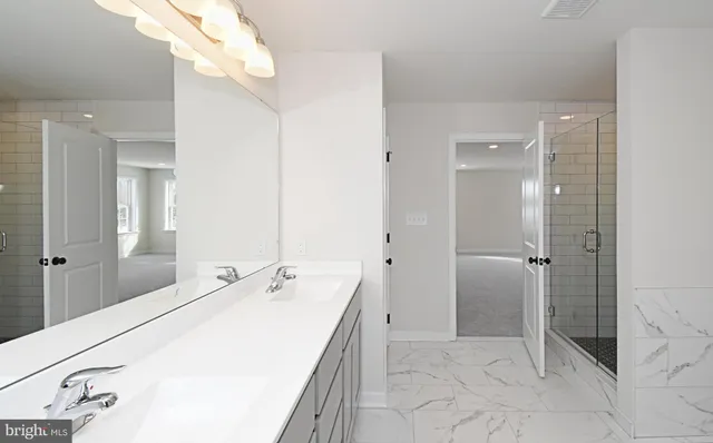 a bathroom with a bathtub and shower