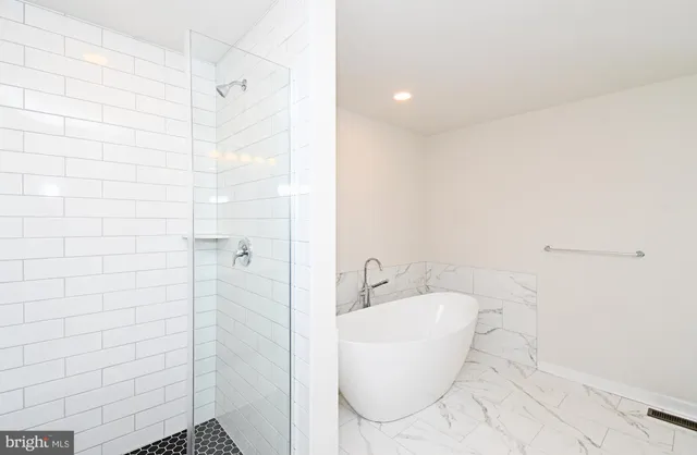 an empty room with a empty space and windows