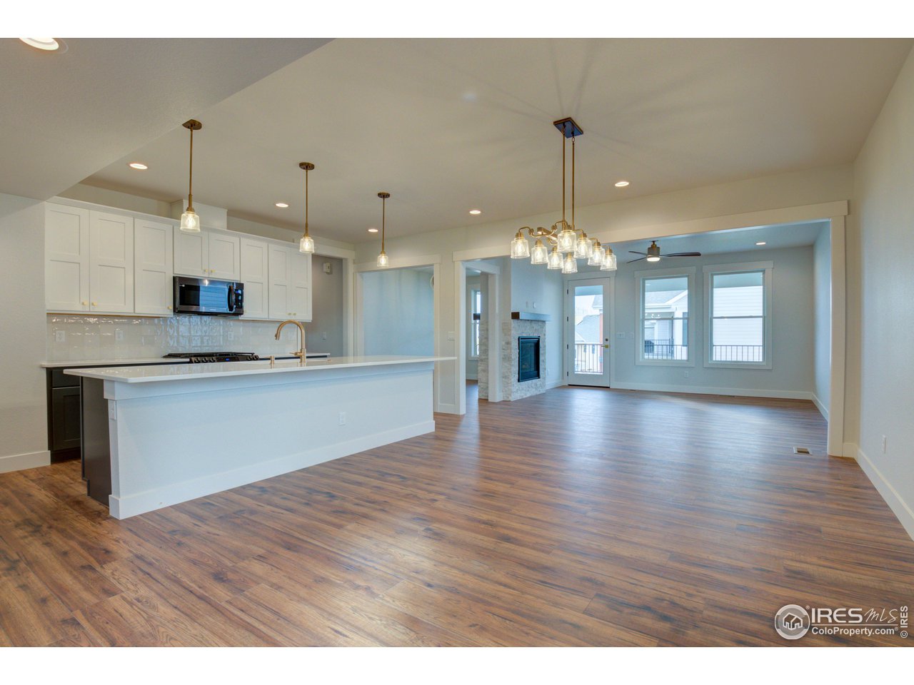 5701 2nd Road Greeley, CO 80634 - Photo 5 of 26 Engineered wood flooring throughout