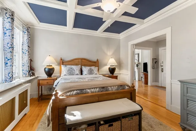 a bedroom with a bed and a table