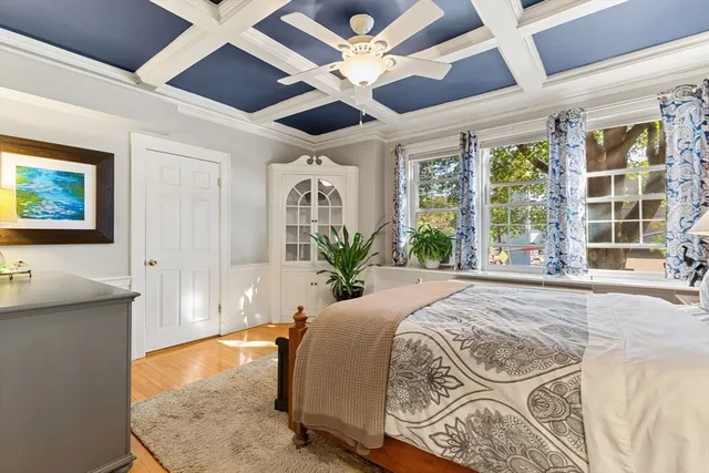 a spacious bedroom with a large bed and a large window