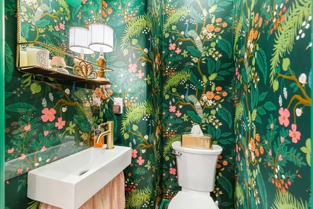 a white bath tub sitting in a bathroom next to a house
