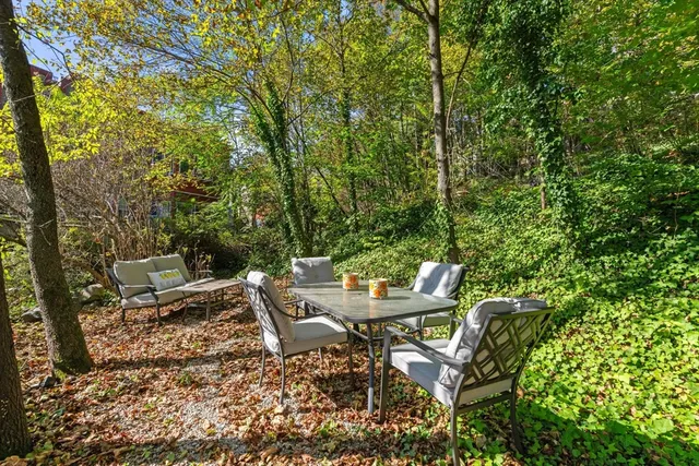 a view of backyard with sitting area