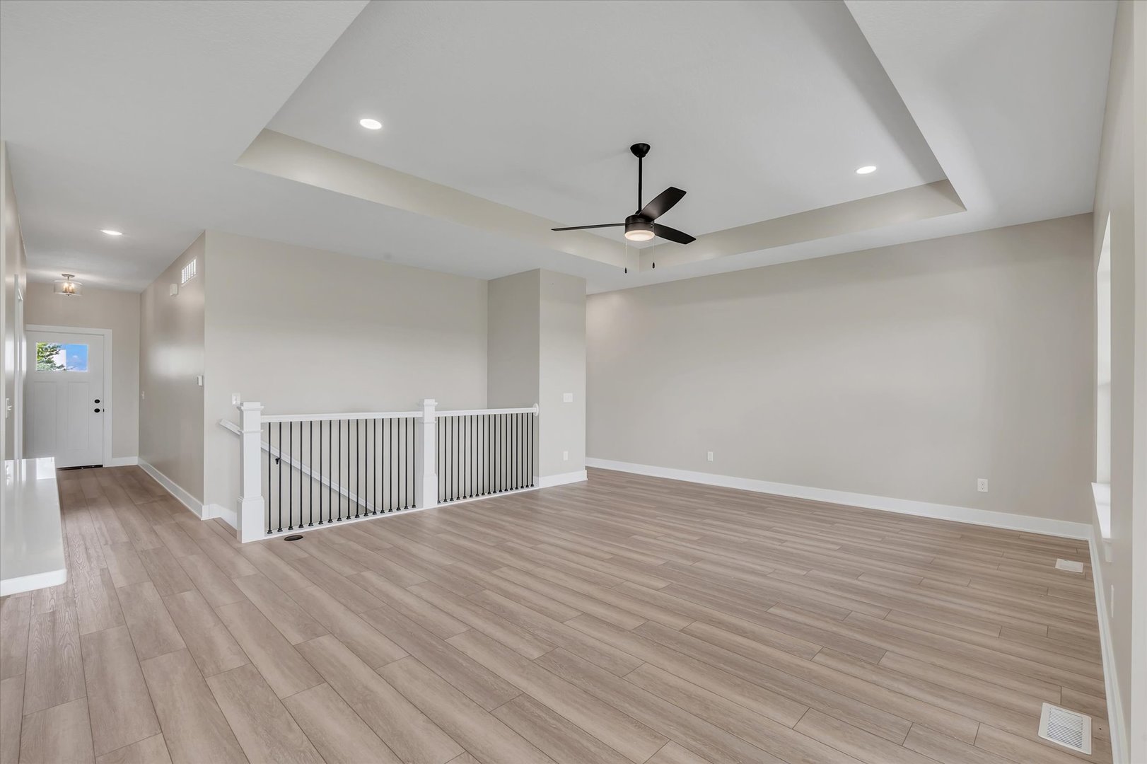 455 Rhonda Road New Liberty, IA 52765 - Photo 13 of 54 a view of a room with wooden floor and ceiling fan