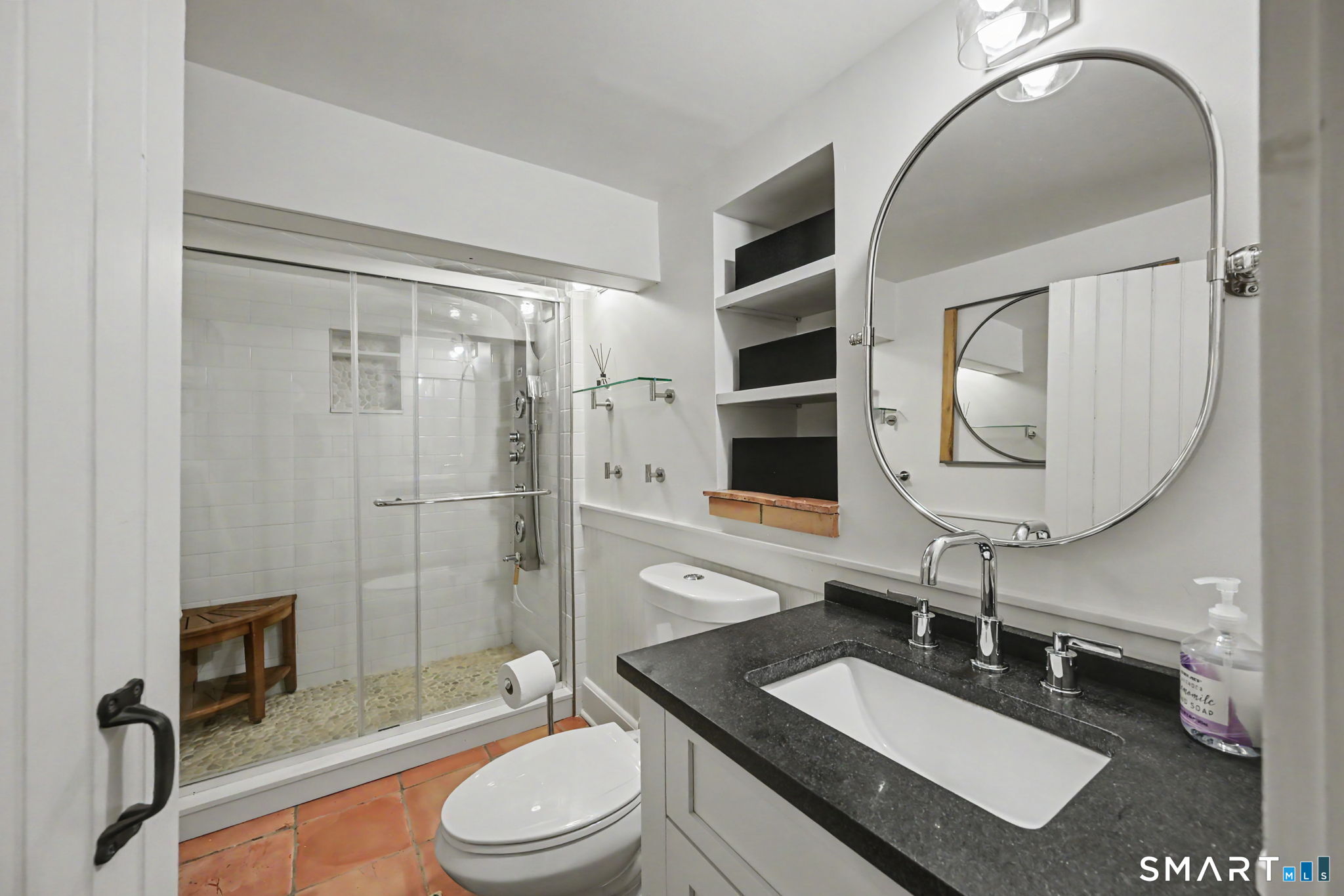 143 Chestnut Hill Road Wilton, CT 06897 - Photo 34 of 40 Lower Level Bath with terracotta tile floors.