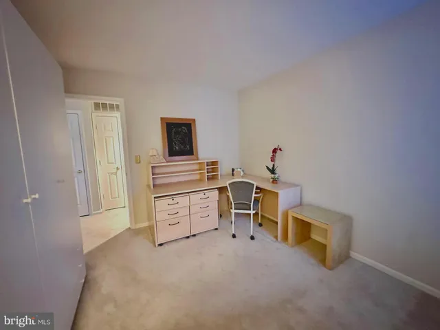 a kitchen with a refrigerator and a stove top oven