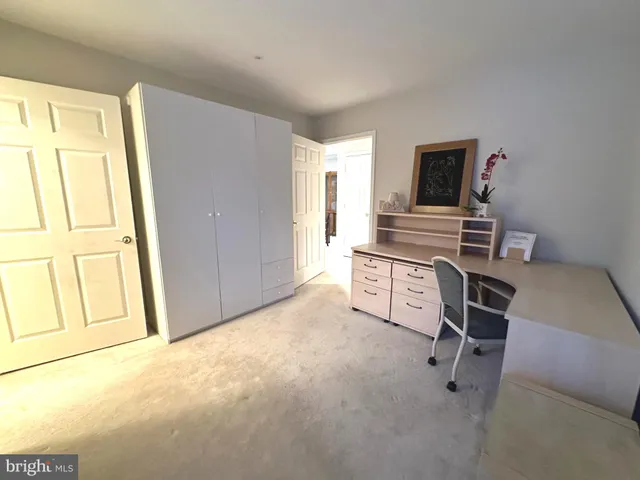 a view of a livingroom with furniture and windows