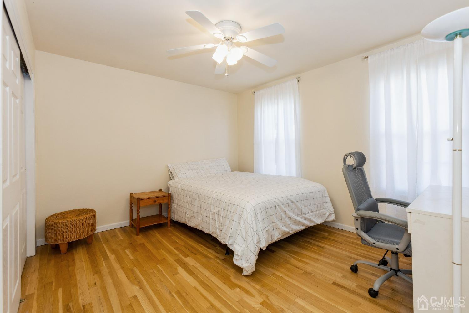 18 Churchill Road Edison, NJ 08820 - Photo 21 of 35 a bedroom with a bed and a chandelier