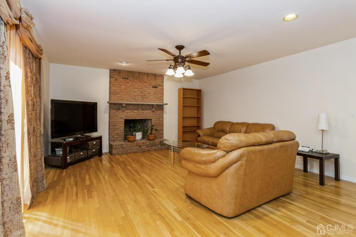 18 Churchill Road Edison, NJ 08820 - Photo 7 of 35 a living room with furniture and a flat screen tv