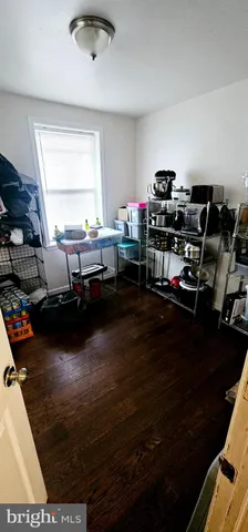 a kitchen with sink and view of living room