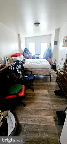 a bedroom with bed and a closet